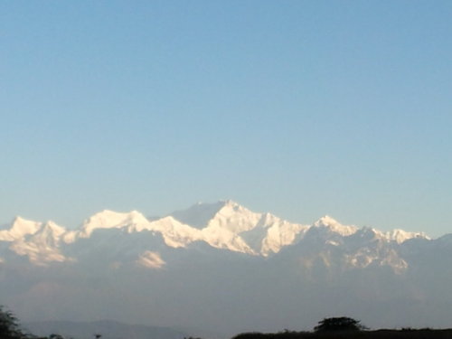 Sun shining across the mountain ranges