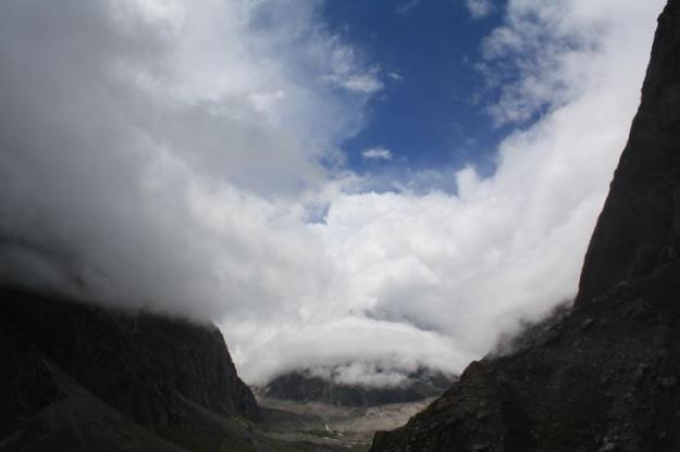 Clouds beside the rocky terrain Uttarakhand, Badrinath, Mana, Himalayas, Vasudhara falls